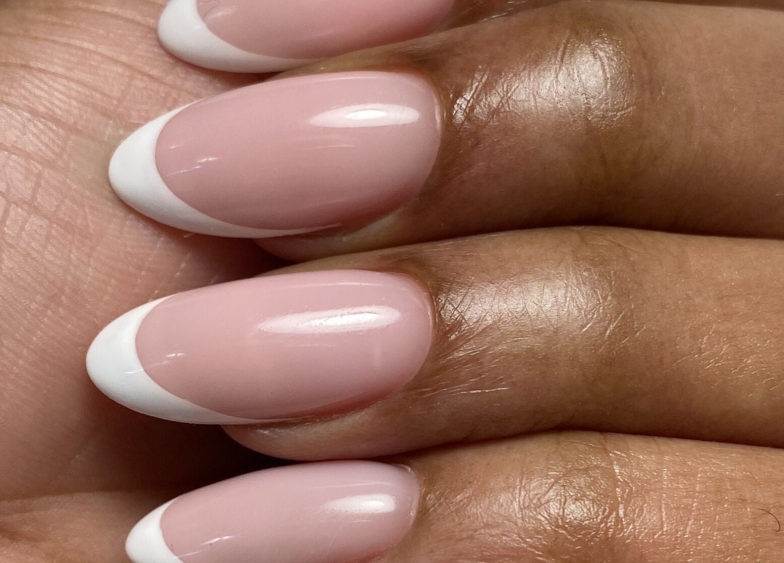 French manicure at Yuliia Nails in Paris, Île-de-France, FR showcasing elegant pink and white tips.