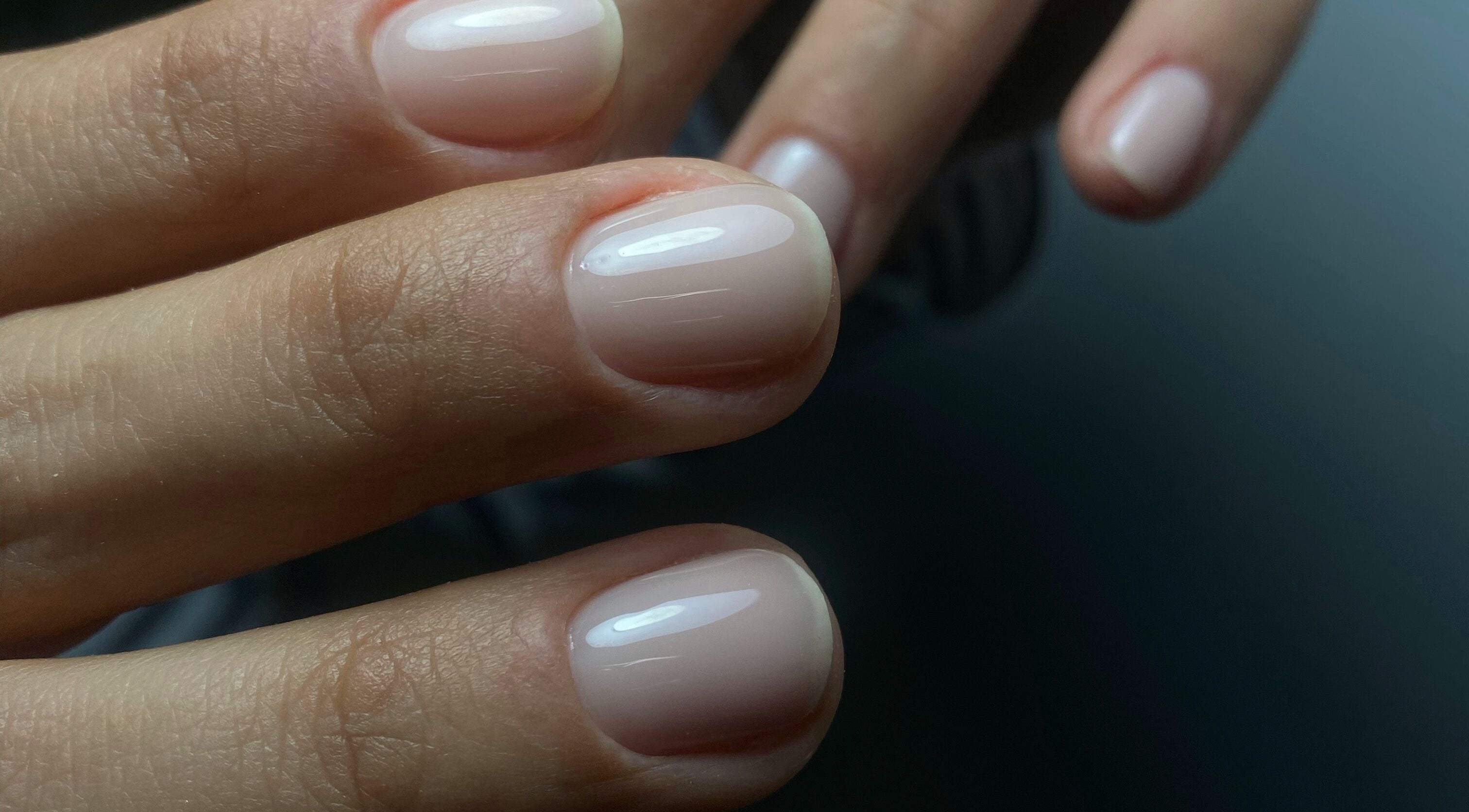 Beautifully manicured hands at Yuliia Nails, Paris, Île-de-france, FR, showcasing glossy pale pink polish.