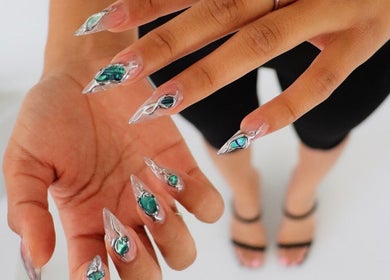 Elegant jewel nail art on hands at nailed.byvaeh, Tulare, California, US.