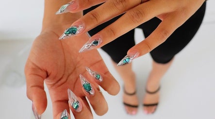 Elegant jewel nail art on hands at nailed.byvaeh, Tulare, California, US.