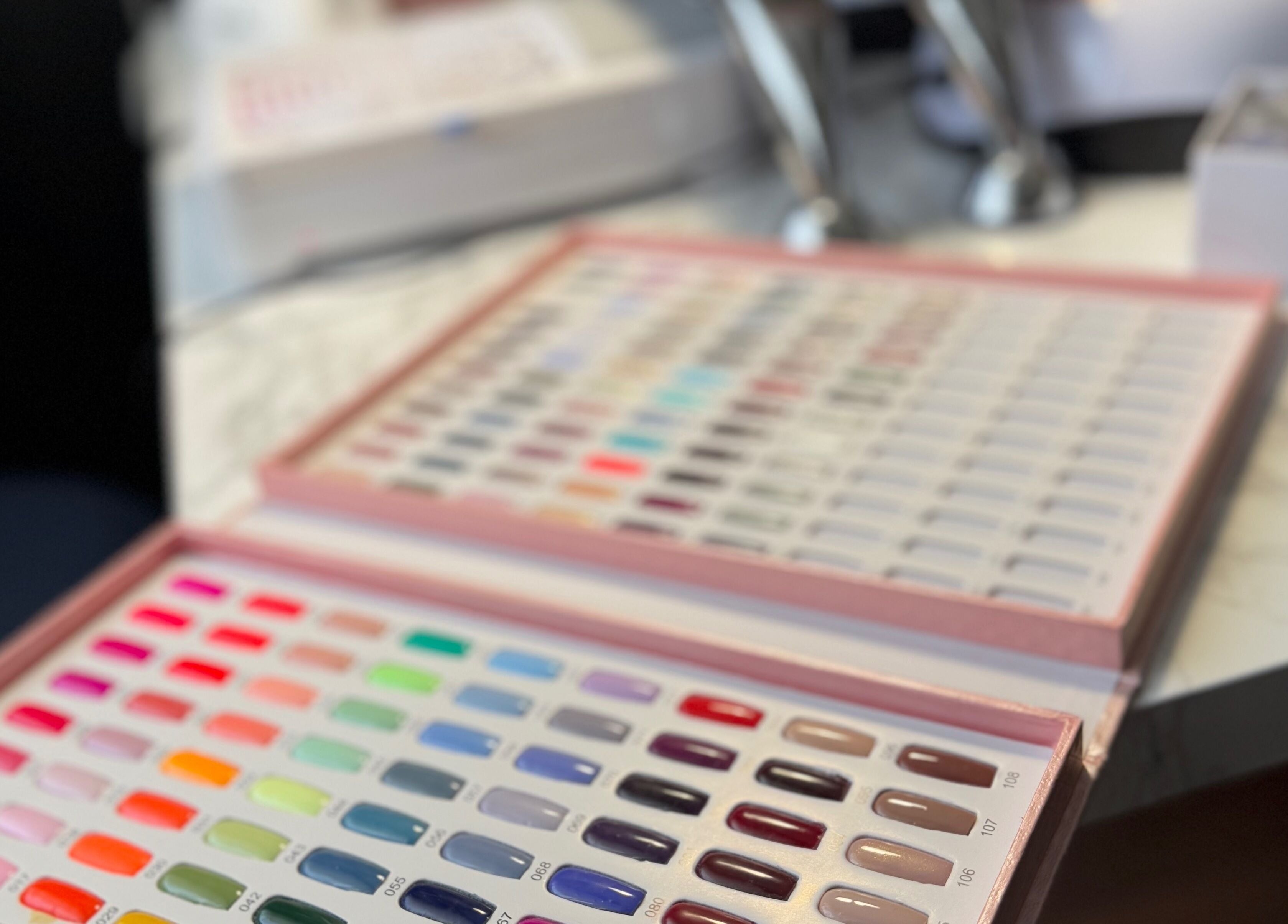 Nail color samples at TC Sports Therapy and Massage in Heelands, England, GB, showcasing vibrant options.