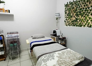 Cozy treatment room at Izelke's Sculpt and Glow Studio in Cape Town, Western Cape, ZA with modern equipment.