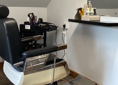 Classic barber chair at Swineshead Barbers, Swineshead, England, GB, showcasing professional styling tools.