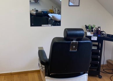 Stylish barber chair at Swineshead Barbers, Swineshead, England, GB, showcasing modern grooming space.