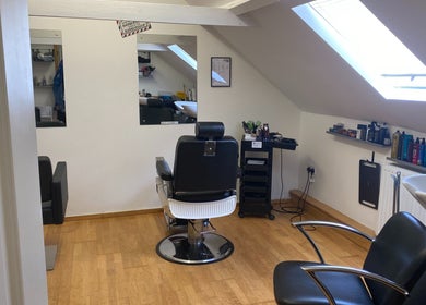 Cozy barber chair setup at Swineshead Barbers, Swineshead, England, GB with modern decor and natural lighting.