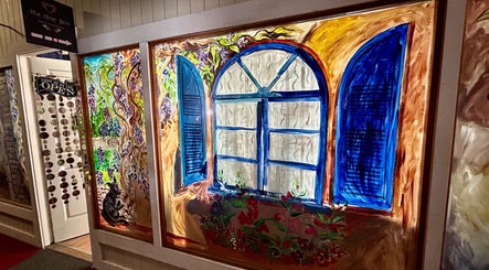 Colorful window mural at The New You Beauty and Wellness, Maclean, New South Wales, AU open for patrons.