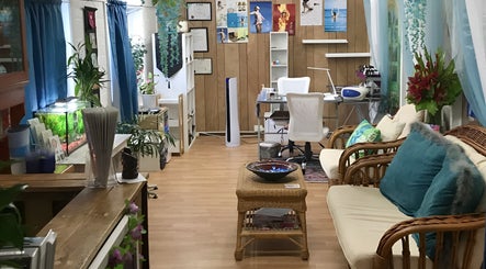 Relaxing interior of The New You Beauty and Wellness in Maclean, New South Wales, AU with lush plants and cozy seating.