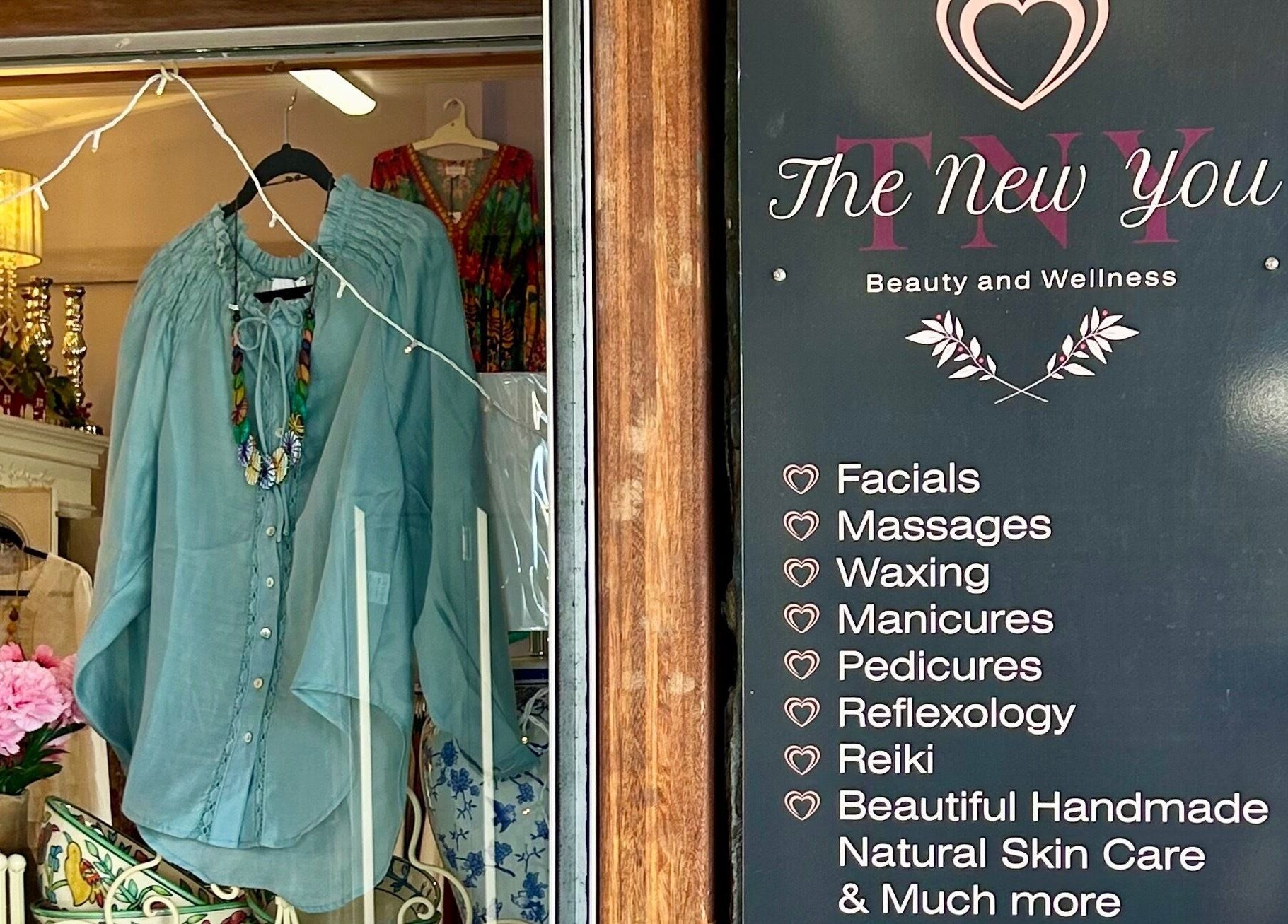 Entrance of The New You Beauty and Wellness, Maclean, showcasing services and elegant decor.