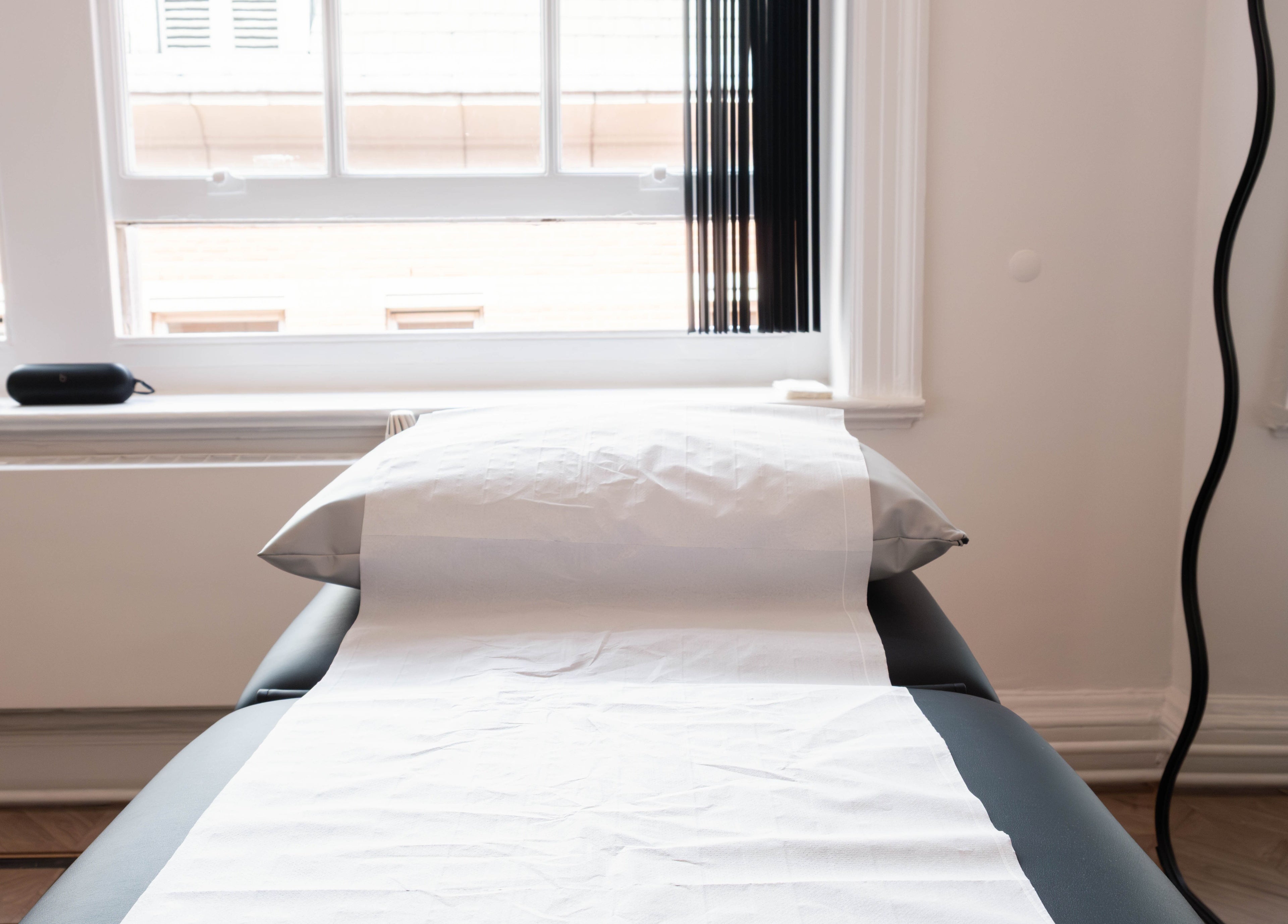 Spa bed in bright room at Soho Beauty & Aesthetics, London, England, GB.