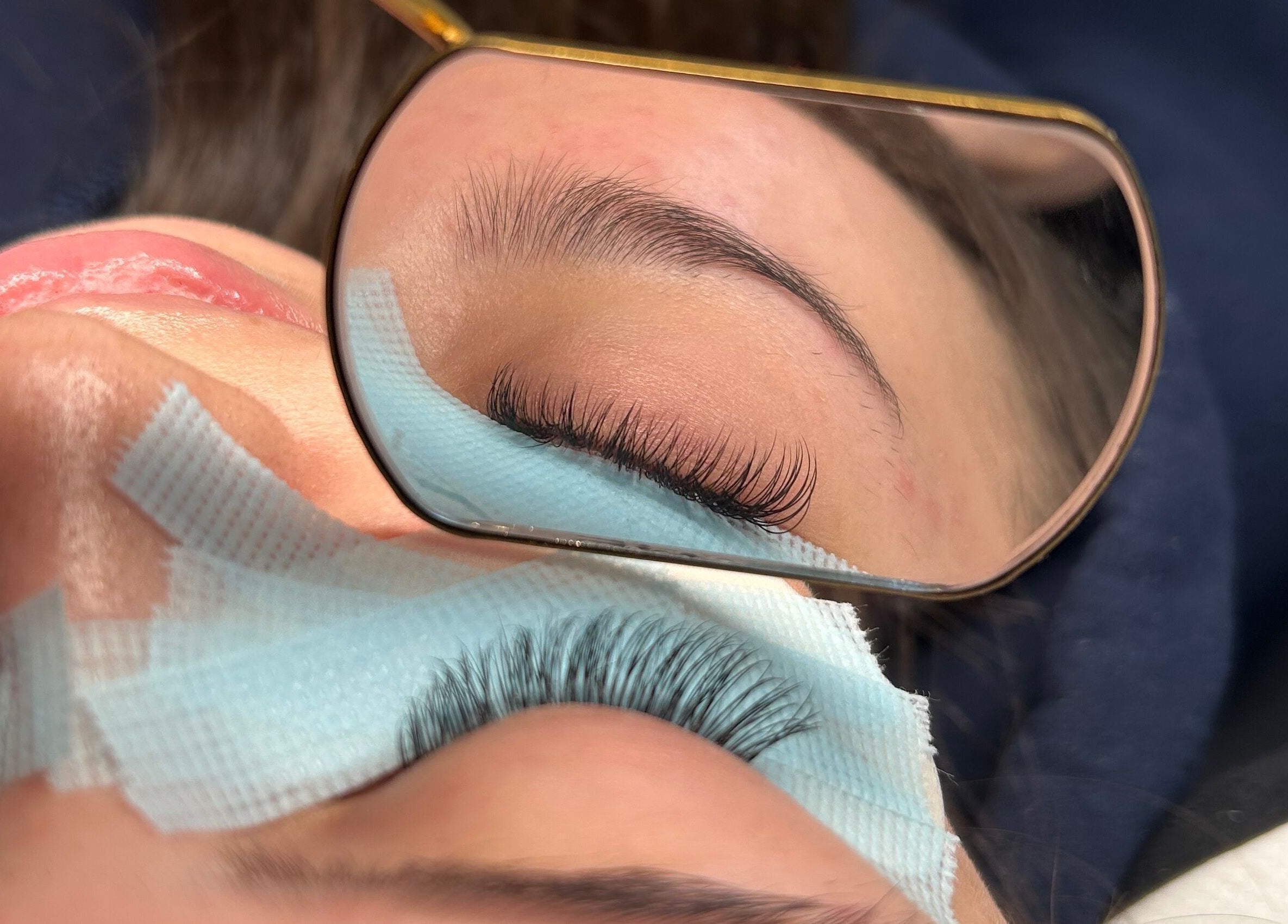 Detailed eyelash extension application at DIVINEGLOWBYSOPHIE in Sandridge, England, GB.