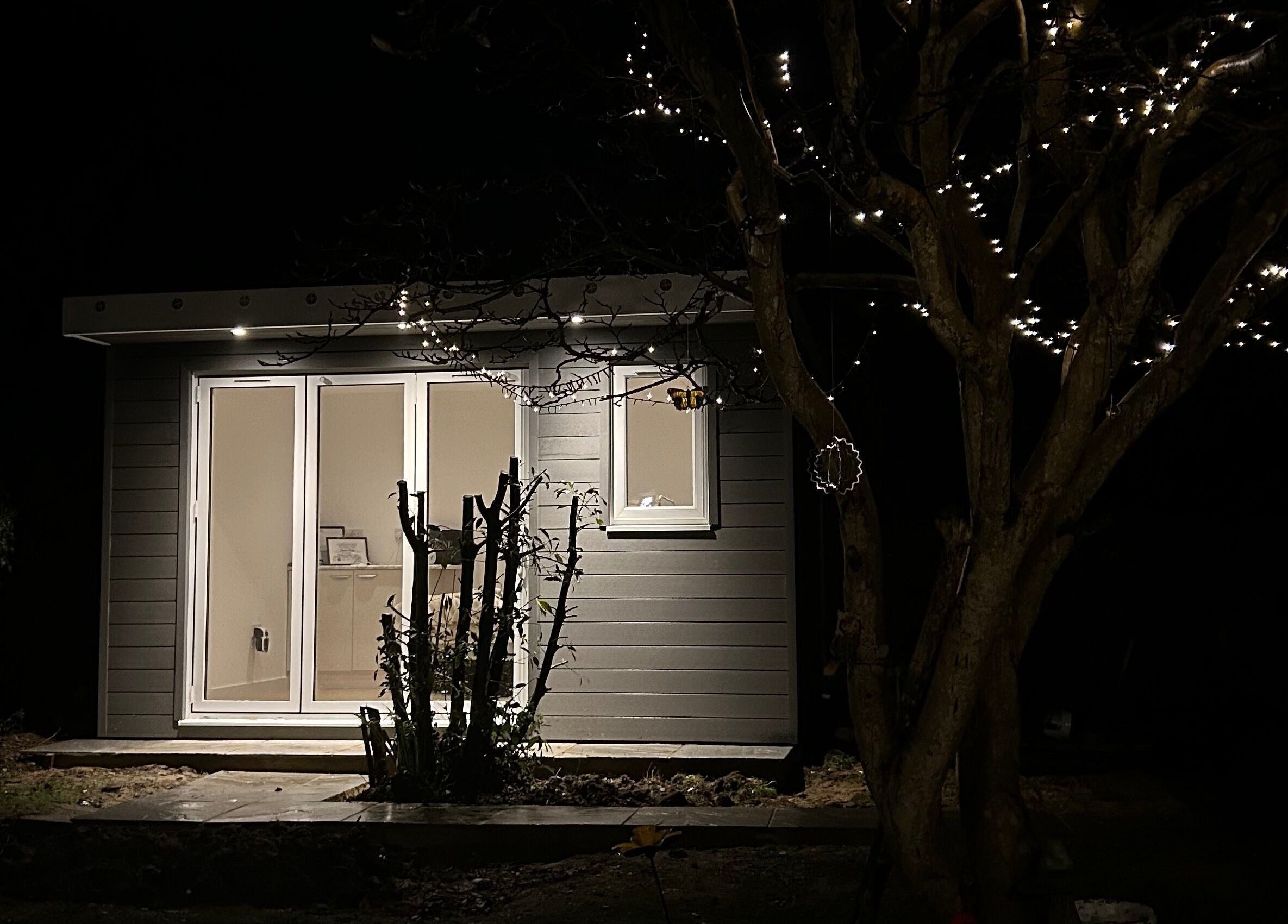 Exterior of DIVINEGLOWBYSOPHIE in Sandridge, England, GB, softly illuminated at night.