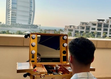 Nouh barber in Dubai, AE offers luxury grooming with a view of iconic skyscraper.