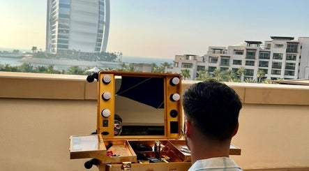 Nouh barber in Dubai, AE offers luxury grooming with a view of iconic skyscraper.