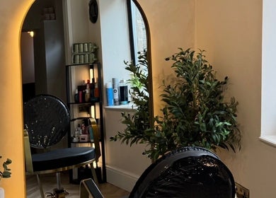 Stylish salon chair and mirror at Rural Roots Studio, Chapel-en-le-Frith, England, GB.