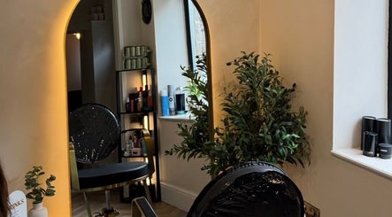 Stylish salon chair and mirror at Rural Roots Studio, Chapel-en-le-Frith, England, GB.