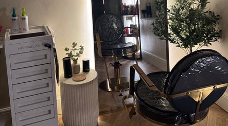 Elegant salon chair and styling area at Rural Roots Studio, Chapel-en-le-Frith, England, GB.