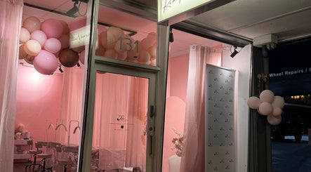Elegant entrance of Ria Makeup And Beauty in Melbourne, Victoria, AU with pink decor and soft lighting.