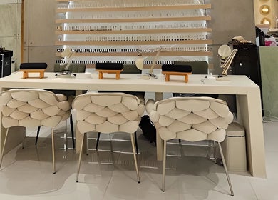 Elegant nail station at The Rustic Sun - Nelayan in Bali, Bali, ID, featuring plush chairs and modern design.