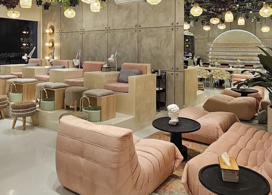 Luxurious seating area at The Rustic Sun - Nelayan, Bali, Bali, ID with modern decor and ambient lighting.