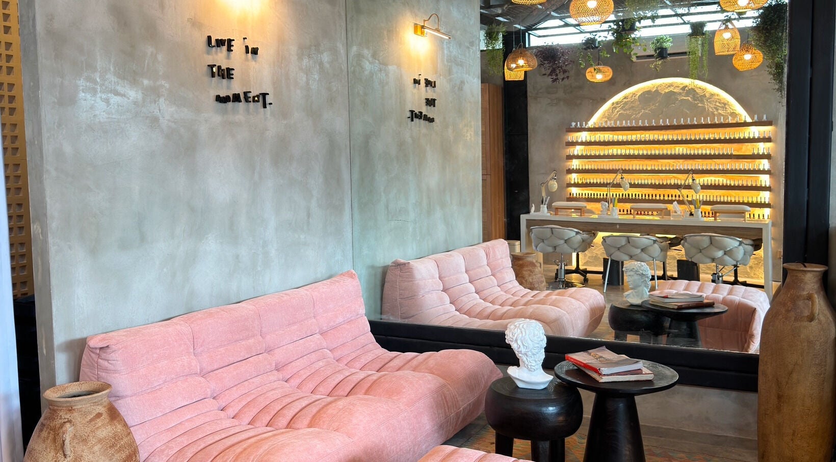 Cozy interior of The Rustic Sun - Nelayan in Bali, featuring plush seating and elegant decor.