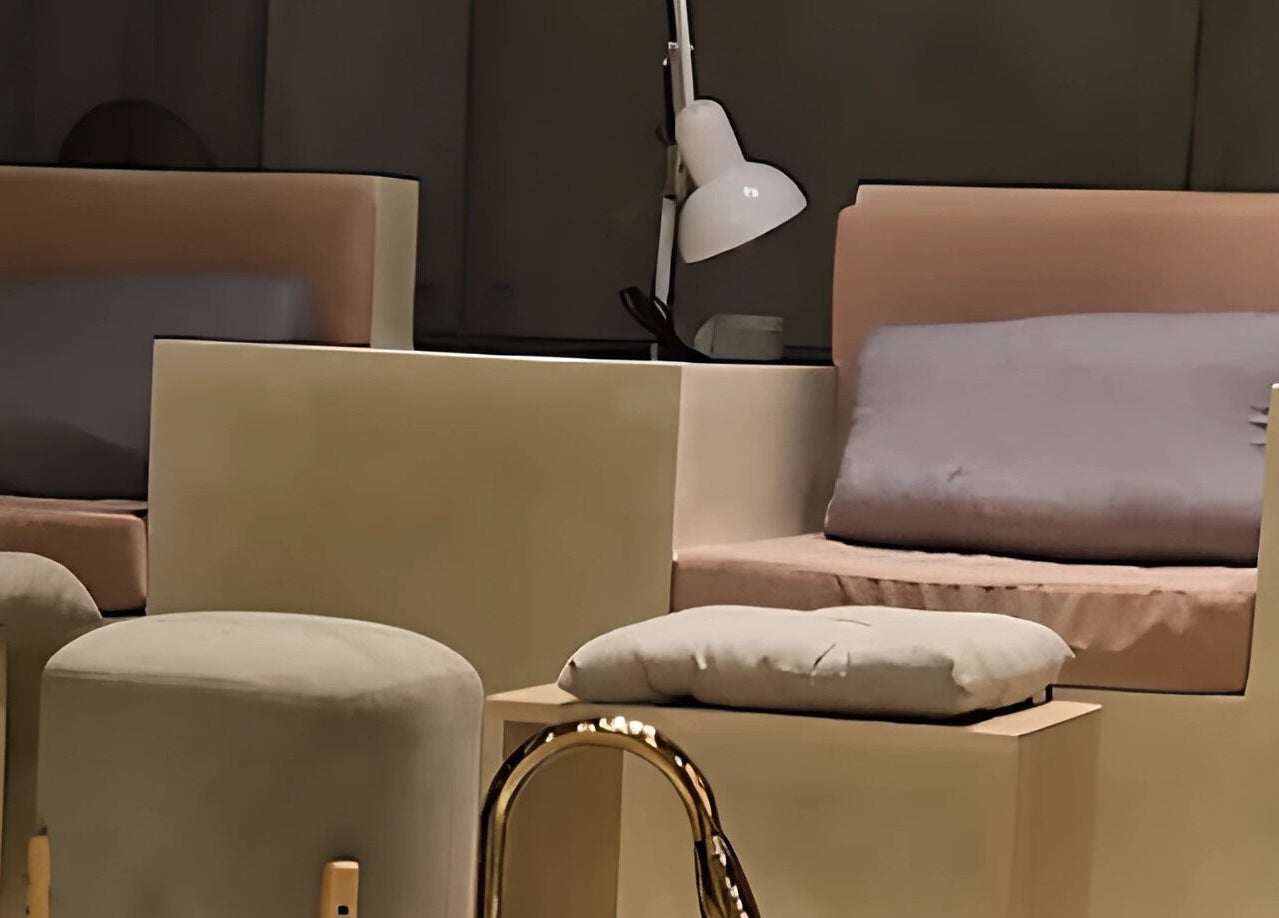 Inviting lounge setup at The Rustic Sun - Nelayan, Bali, Bali, ID with plush seating and serene lighting.