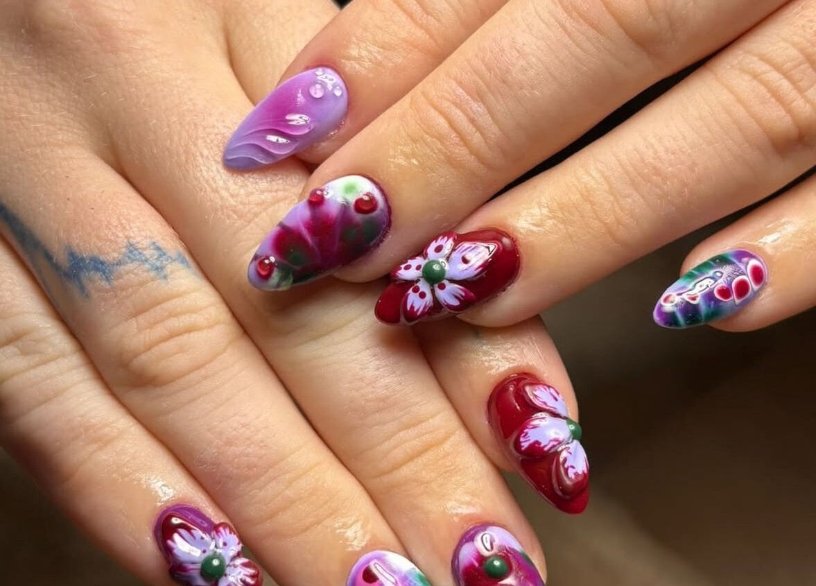 Floral nail art design at The Rustic Sun - Nelayan, Bali, Bali, ID showcasing colorful 3D flowers.