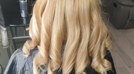 Blonde curls styled at TheGingerStylist, Rochdale, England, GB, showcasing expert hair techniques.