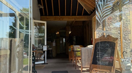 Inviting entrance of Flawless Clinic, Wellington, England, GB featuring stylish decor and cozy seating.