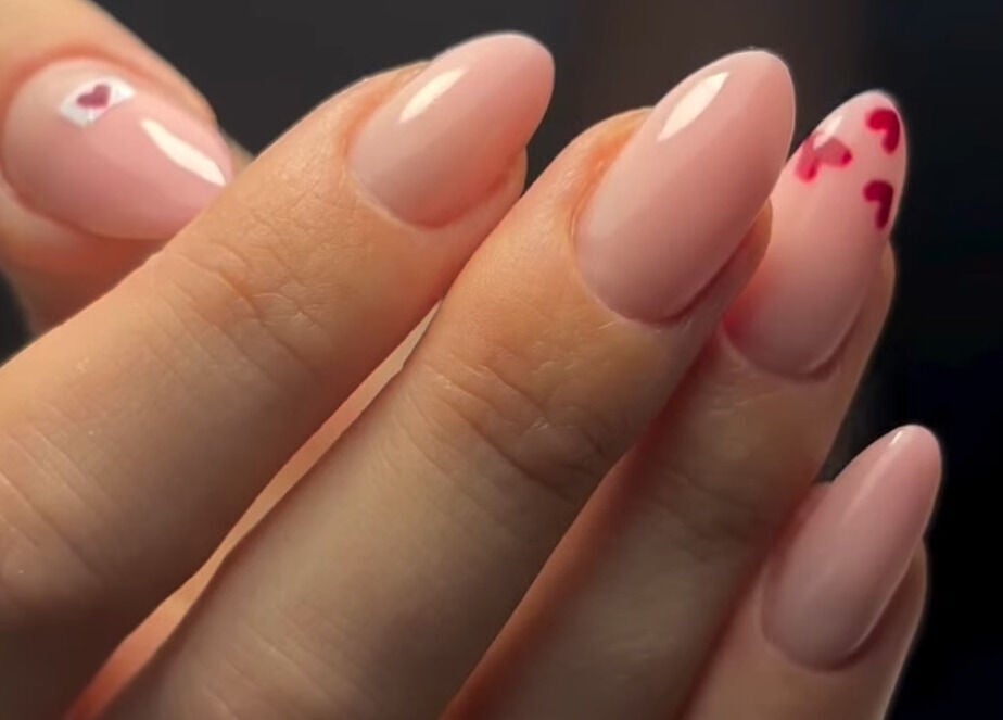 Elegant nail art design at Studio 1 Beauty By Zoe, Exeter, England, GB, showcasing pink hues and heart details.