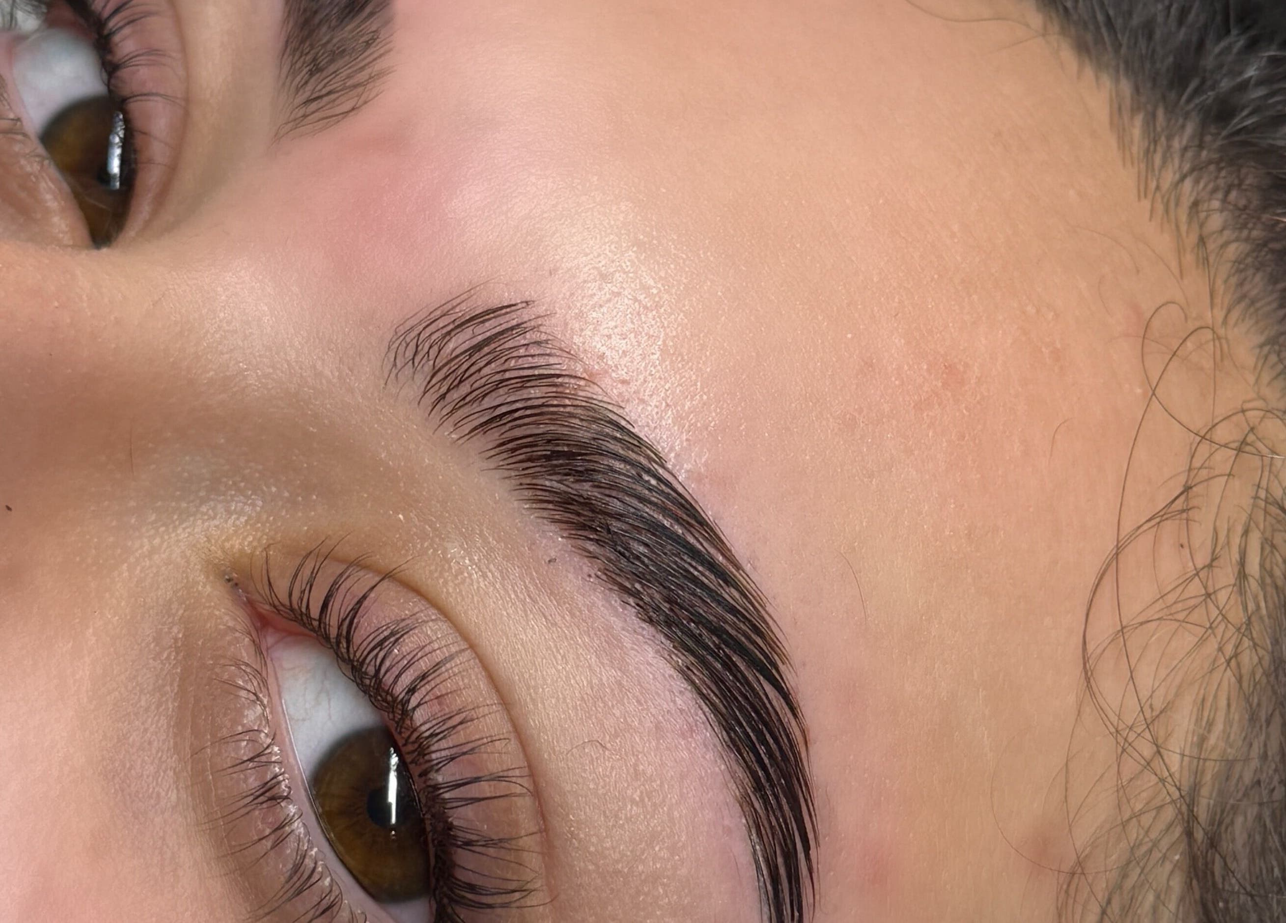 Close-up of elegantly shaped eyebrows at Beautycallsmcr | Skulpt Studios, Manchester, England, GB.