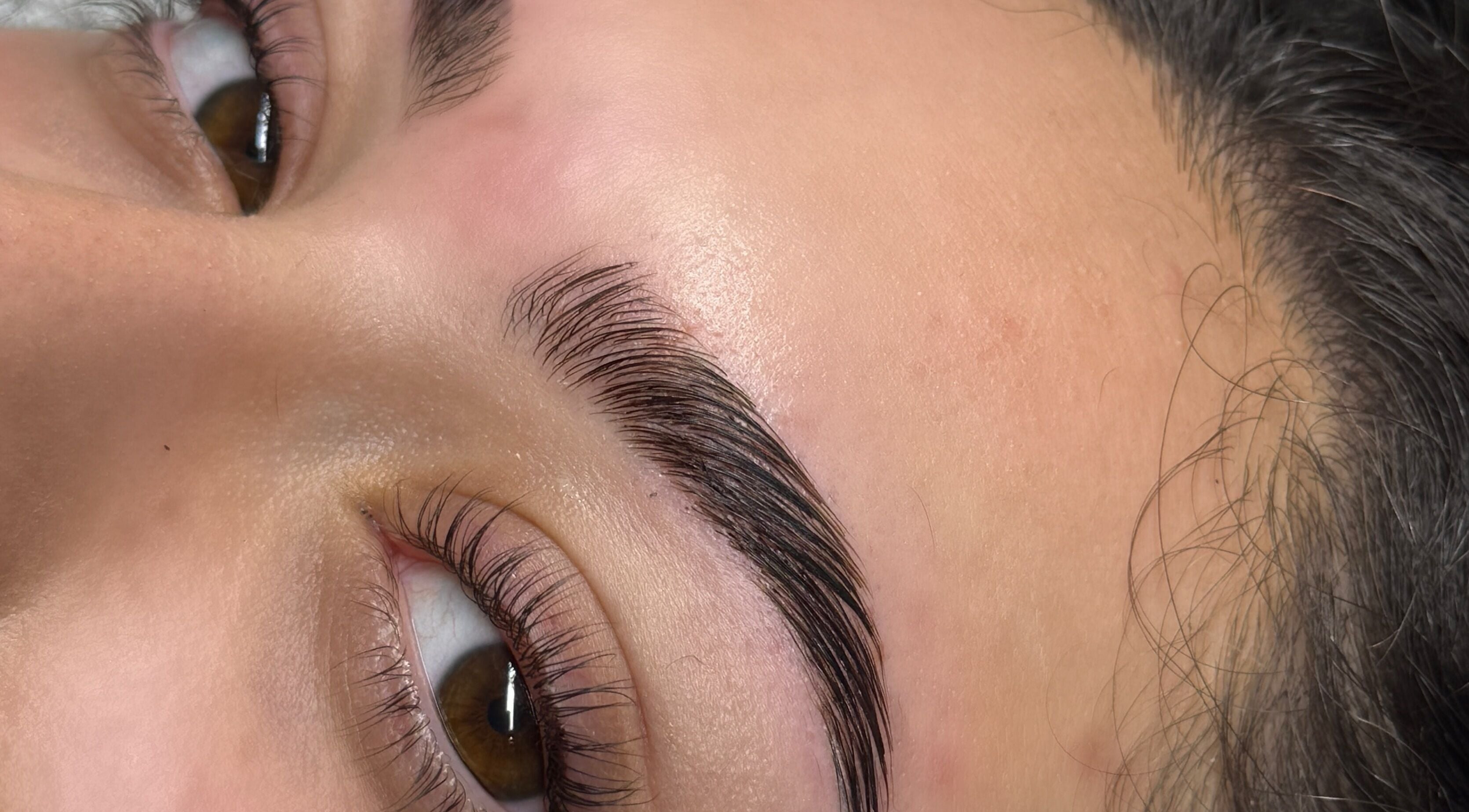 Close-up of elegantly shaped eyebrows at Beautycallsmcr | Skulpt Studios, Manchester, England, GB.