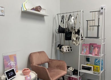 Stylish seating with bags and products at Lucid Lashes, Antigonish, Nova Scotia, CA.