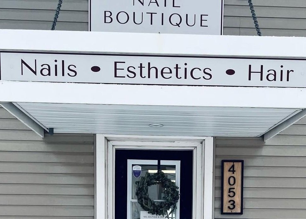 Lucid Lashes entrance with signage for nails, esthetics, hair in Antigonish, Nova Scotia, CA.