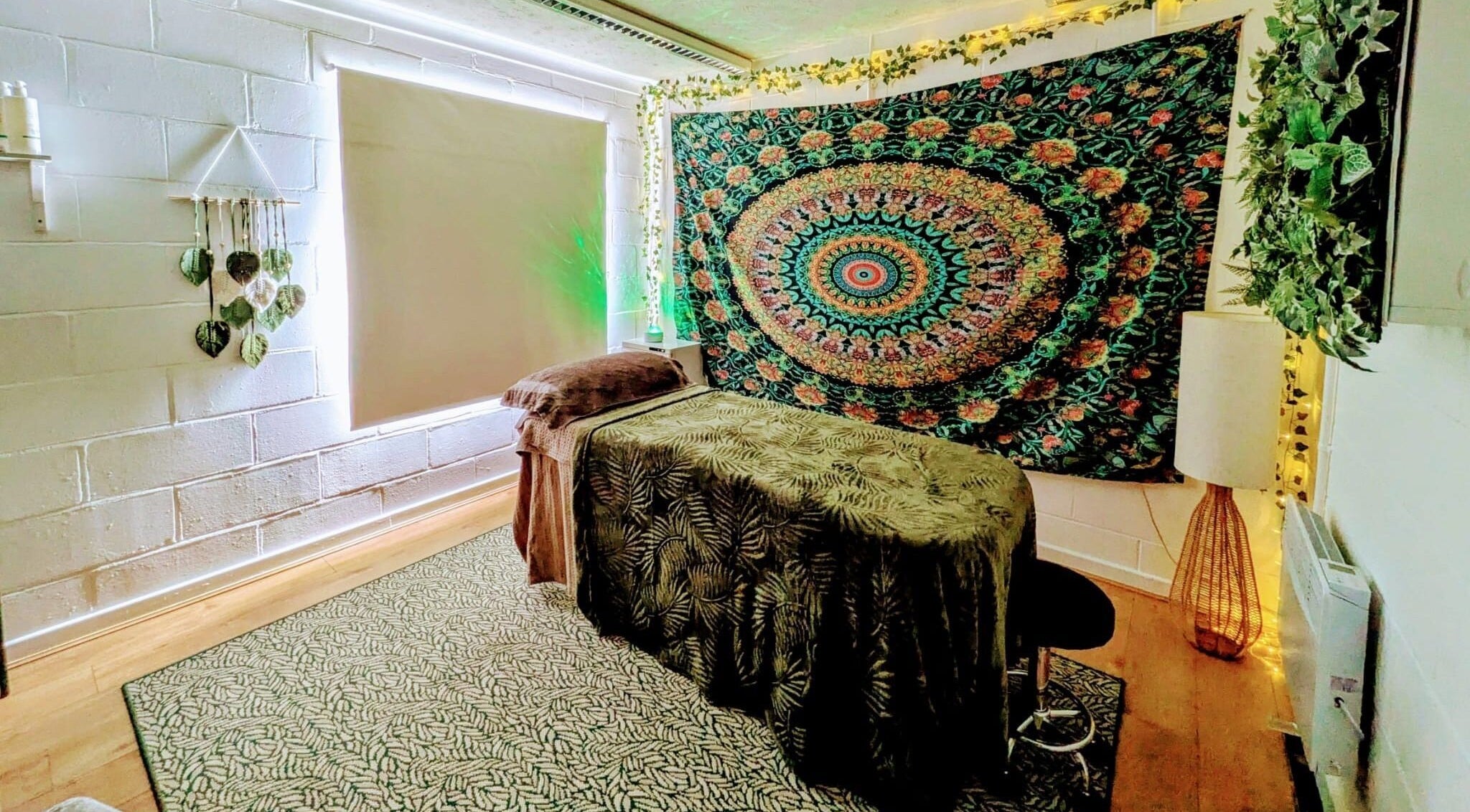 Tranquil massage room at New Leaf Massage, Brandon, England, GB, featuring calming decor and ambient lighting.