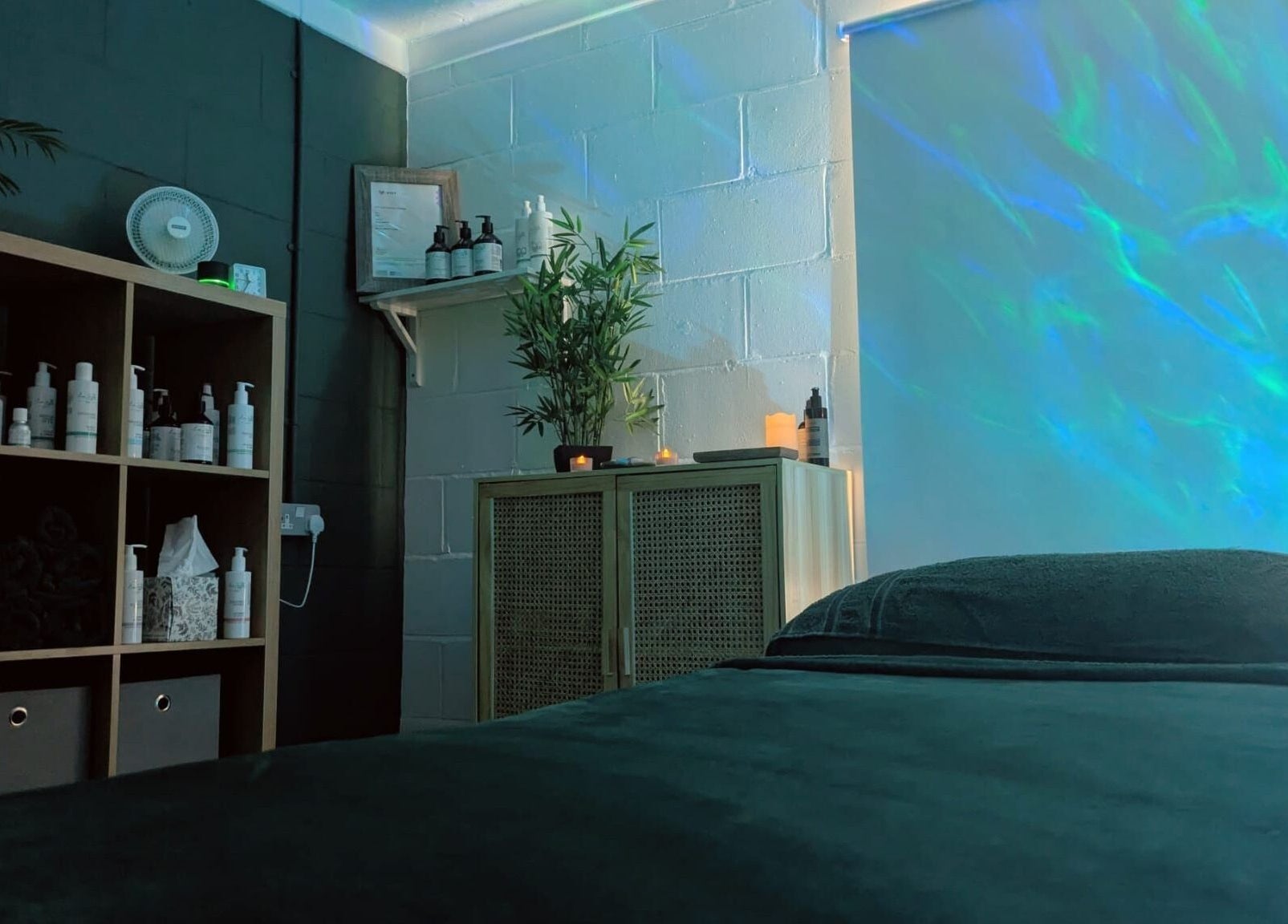 Tranquil massage room at New Leaf Massage in Brandon, England, GB with soothing lighting and decor.