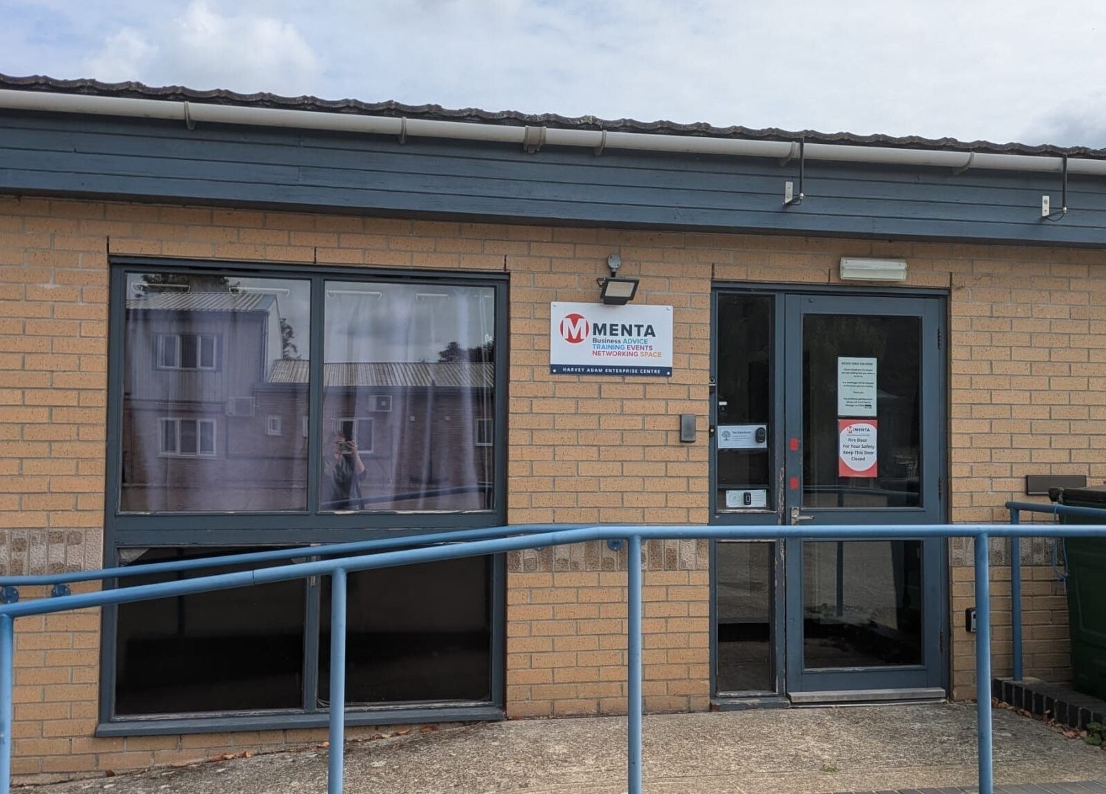 Entrance of New Leaf Massage, Brandon, England, GB featuring modern brick design and accessibility ramp.
