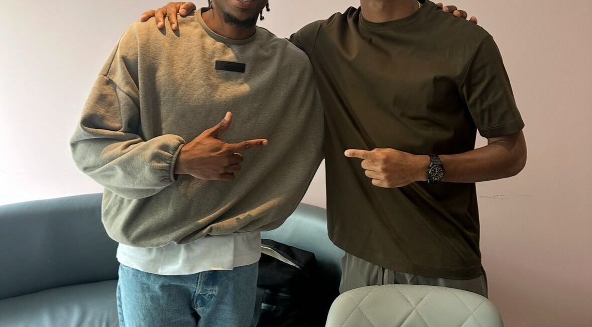 Two people smiling and pointing at each other inside Jefe Barbers - Stockport, Stockport, England, GB.