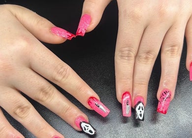 Stylish pink Halloween nail art at Beauty By Amc, Glasgow, Scotland, GB showcasing creative designs.
