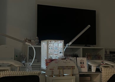 Bloom Nail Beauty workspace in Burwood, New South Wales, AU featuring nail polish display and modern lighting.