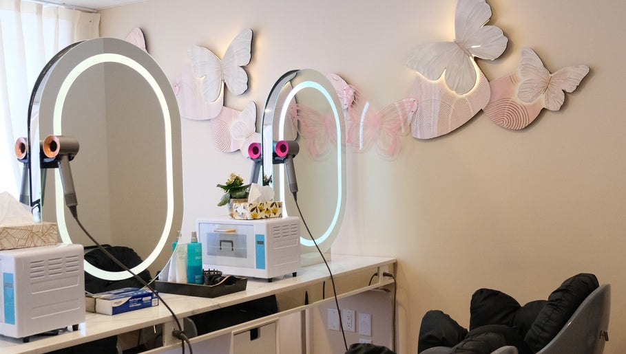 Chic styling station at Fans Head Spa Oakville adorned with illuminated butterflies in Oakville, Ontario, CA.