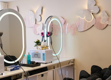 Chic styling station at Fans Head Spa Oakville adorned with illuminated butterflies in Oakville, Ontario, CA.