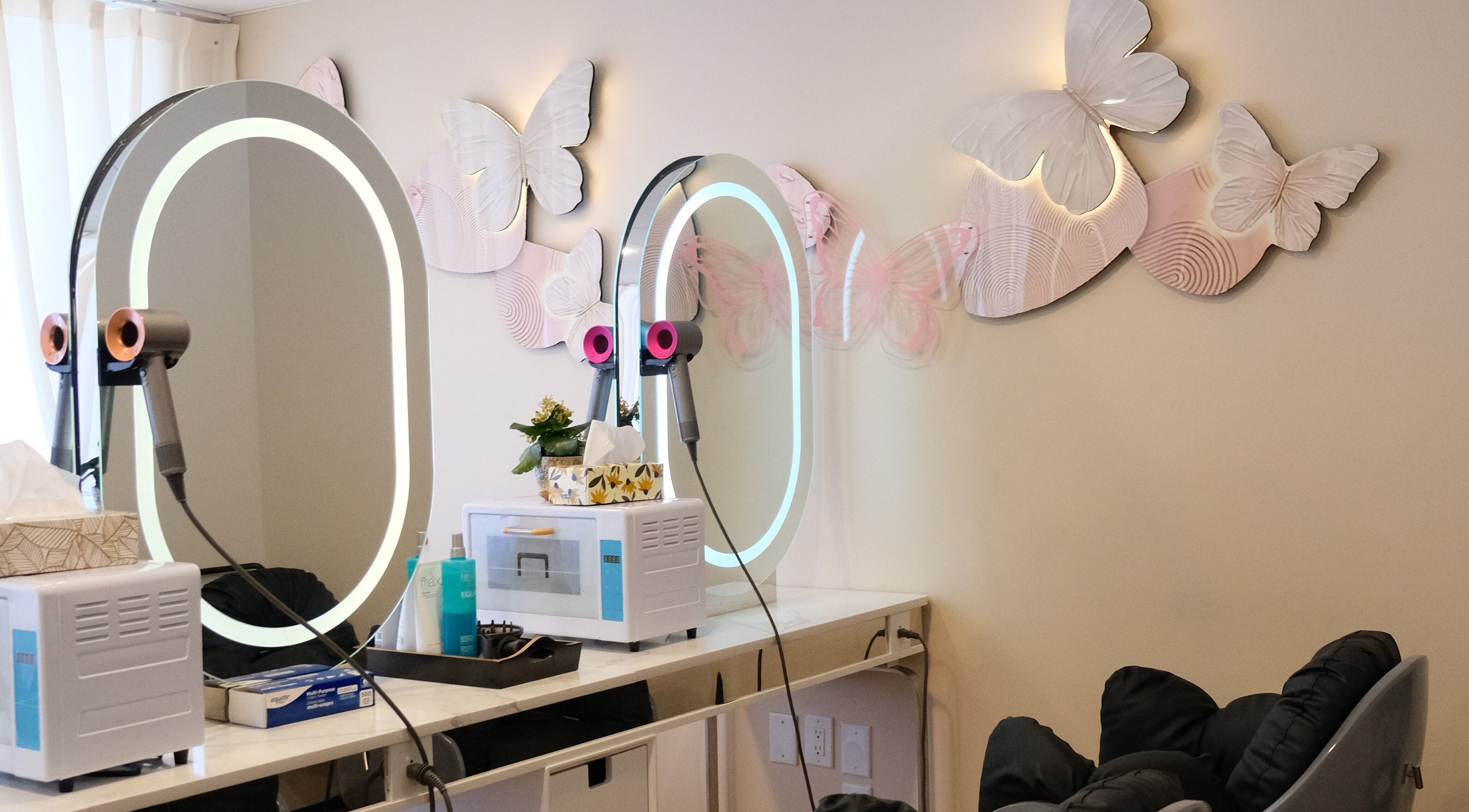 Chic styling station at Fans Head Spa Oakville adorned with illuminated butterflies in Oakville, Ontario, CA.