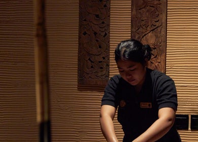 Therapist at ATMOS BodyLab in Bali, Bali, ID providing a calming massage service.