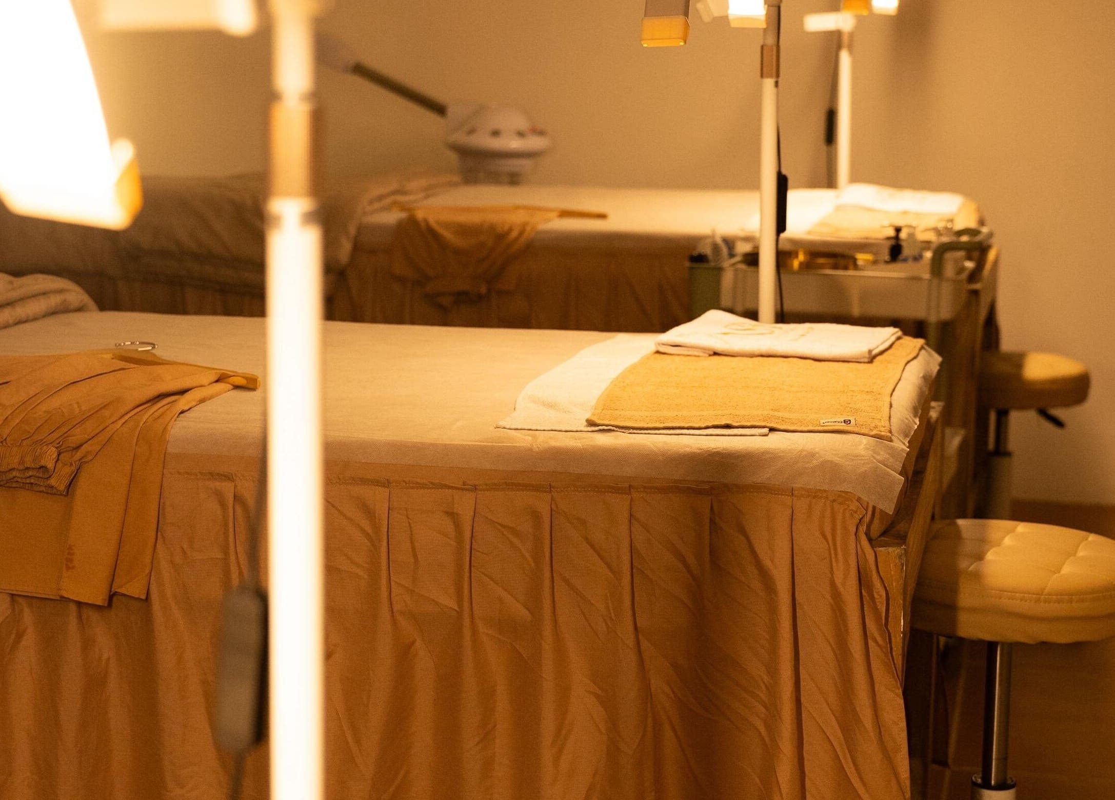 Tranquil treatment room at NSB Beauty Studio Bukit Jimbaran, Bali, Bali, ID, featuring warm lighting and comfortable beds.