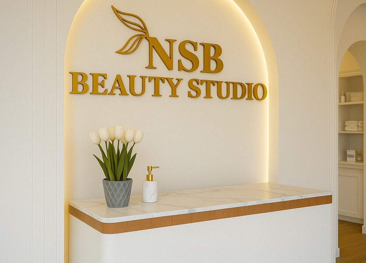Reception desk at NSB Beauty Studio Bukit Jimbaran, Bali, Bali, ID, adorned with tulips and gold accents.