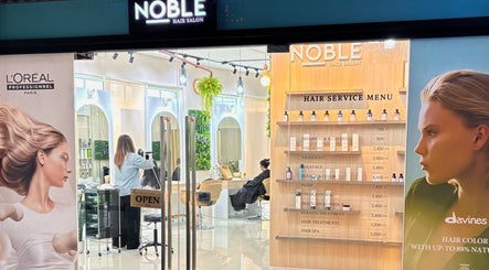 Noble Hair Salon Bangkok entrance with service menu, located in Krung Thep Maha Nakhon, TH.