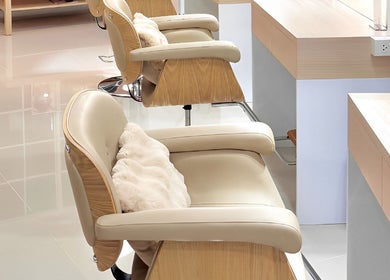 Elegant chairs in Noble Hair Salon Bangkok reflect sophistication. Location: Krung Thep Maha Nakhon, TH.