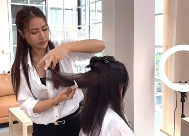 Hairdresser styling at Noble Hair Salon Bangkok, Krung Thep Maha Nakhon.