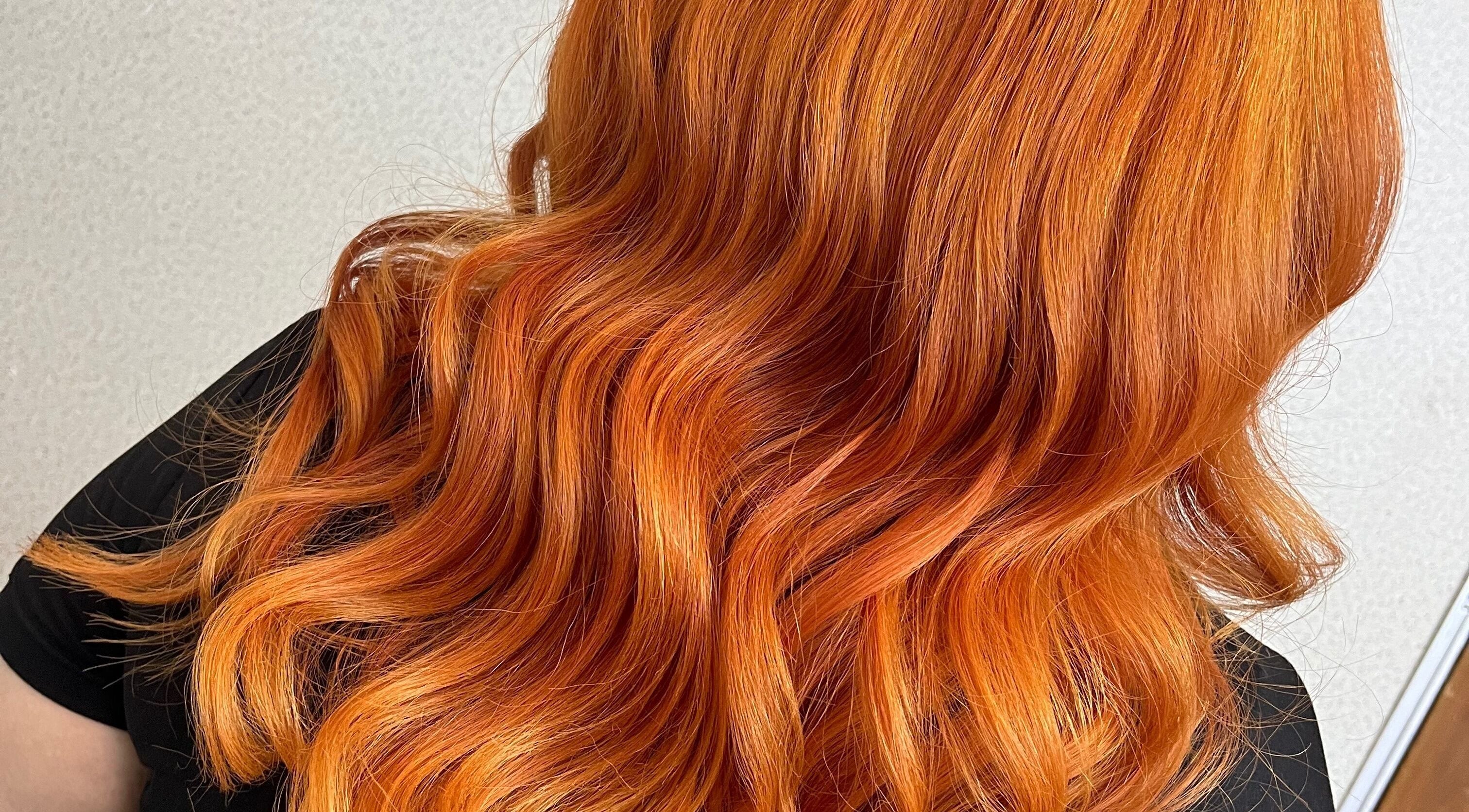 Vibrant orange hair styled in soft waves at Lana Beauty Salon Senawang, Seremban, Negeri Sembilan, MY.