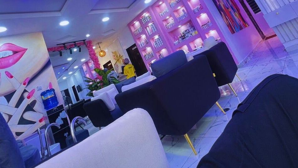Modern interior of Xtragleam Aesthetic Clinic in Ishara, Ogun State, NG, featuring plush seating and vibrant decor.